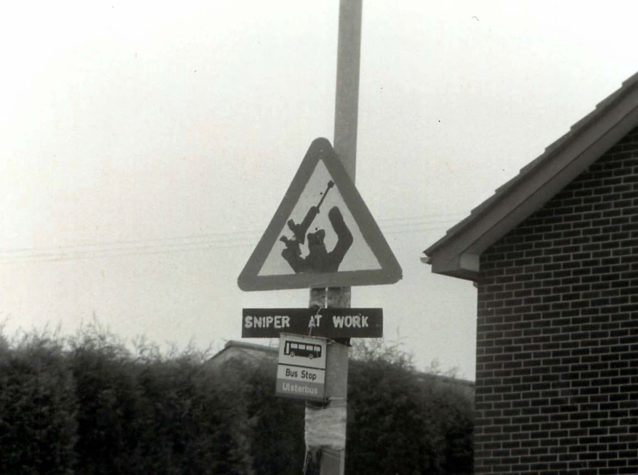 IRA 'Sniper at Work' sign on a bus stop pole in South Armagh